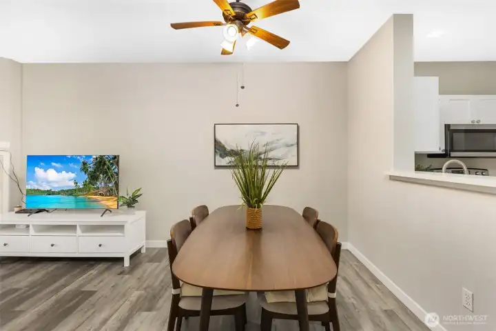 The open design allows flexibility for formal dining or relaxed everyday use. This space easily accommodates entertaining while maintaining an intimate feel.