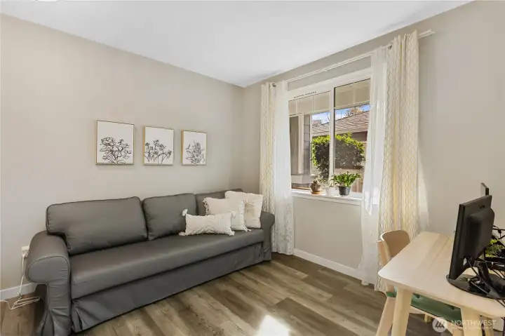 The secondary bedroom offers flexibility to meet a variety of lifestyle needs. Ideal as a guest room, home office, or creative workspace.