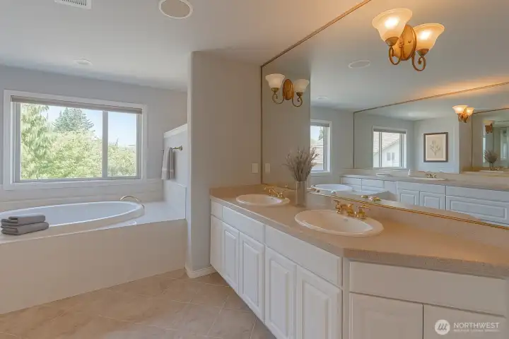 Virtually staged. Another view of the primary bath.