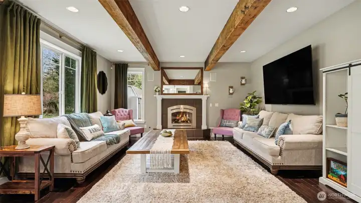 Enjoy exposed beam ceilings and a warm fireplace.