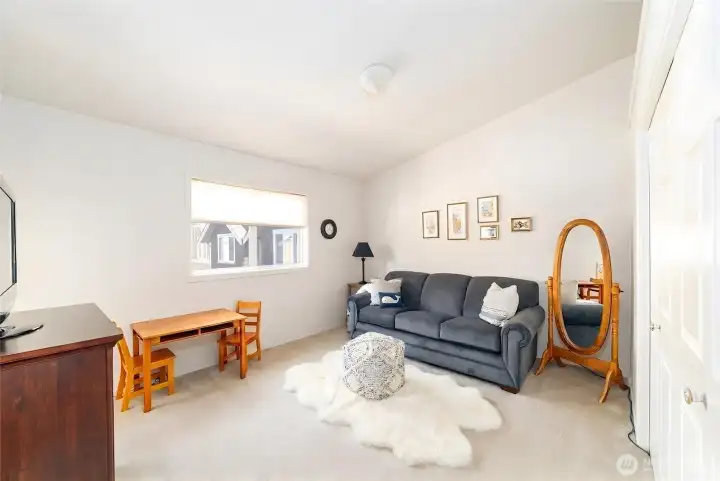 Well-appointed guest bedroom/home office with connecting door to the second outdoor deck