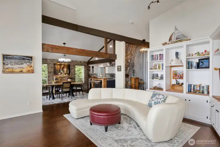 The vaulted ceilings, beams and engineered hardwood floors lend to the exquisite style.