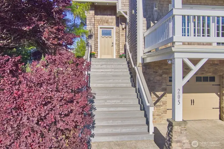 The welcoming front entry sets the tone for guests, while owners enjoy the convenience of direc access through the ground level garage.