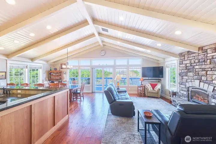 Vaulted shiplay ceilings with architectural beams elevate the space with texture, character and craftmanship.