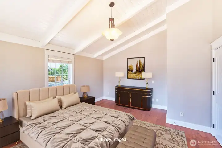 Airy and inviting, the primary bedroom offers comfort and character.