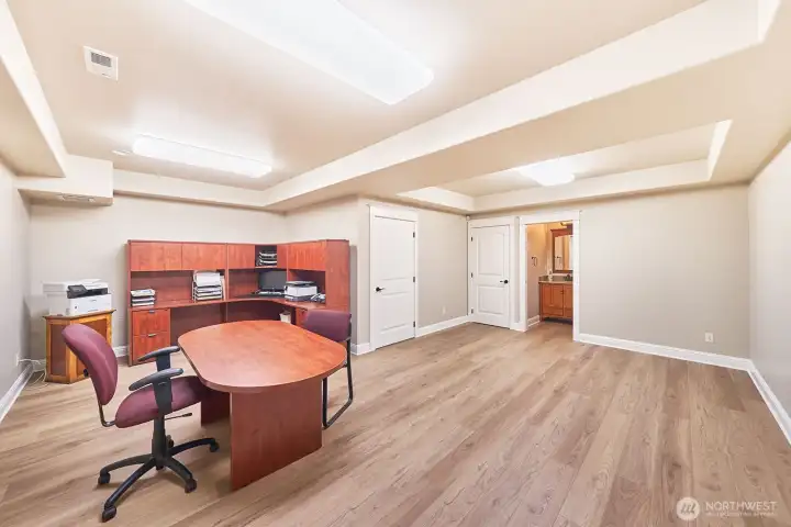 On the ground floor, a versatile bonus space offers endless possibilities -  home office, gym, guest suite, or creative studio.