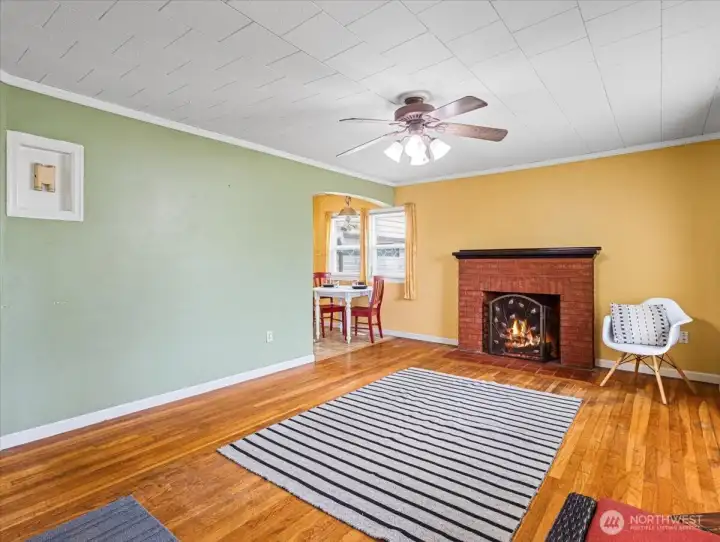Living room, hardwood floors, wood-burning fireplace