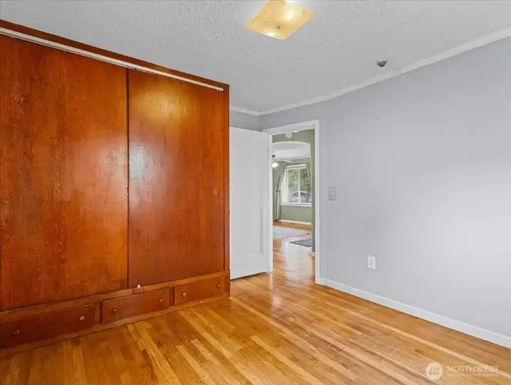 Primary bedroom, hardwood floors, large closet