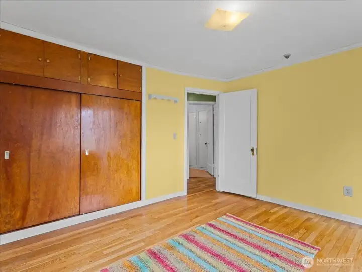 Primary bedroom, hardwood floors, large closet