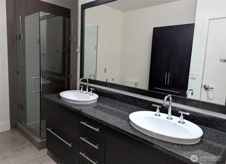 Master bathroom with shower and double vanity