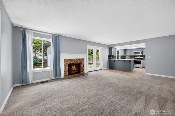 The family room is open to the kitchen & provides easy access to outdoor entertaining areas!