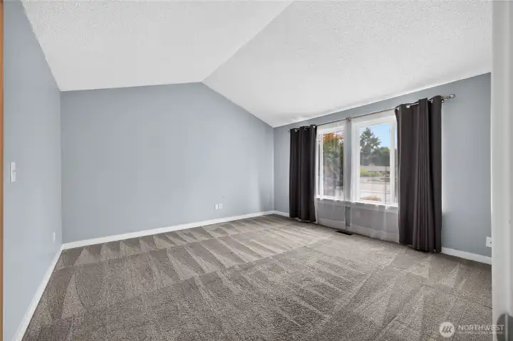 Spacious primary bedroom provides space for larger furniture!