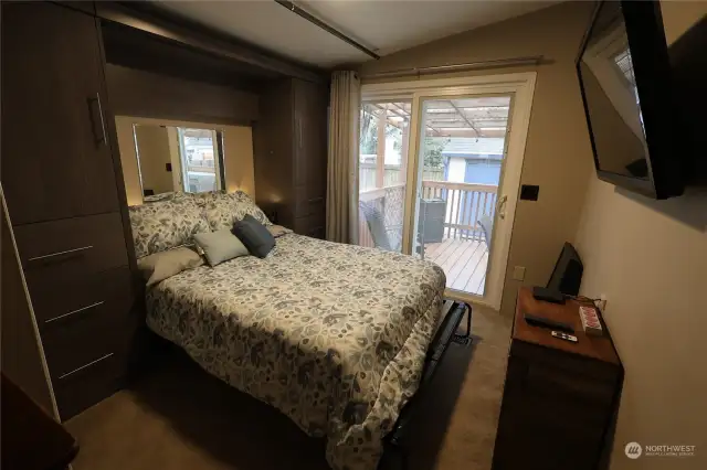 Bedroom 3 with sliding door to the back deck with outdoor kitchen.