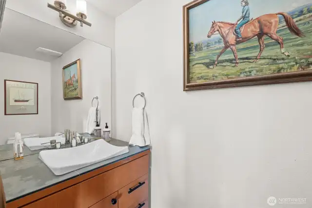Half bath on lower level next to family room. Custom fixtures. The usual quality casement storage throughout.