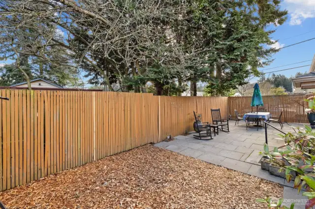 Fully fenced back yard. Patio and play area, room for flowers and vegetable garden, all that brings you joy.
