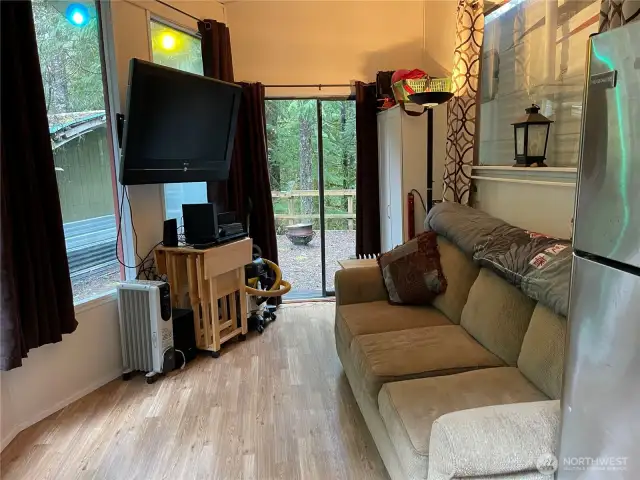 Plenty of room to watch some TV in covered deck area