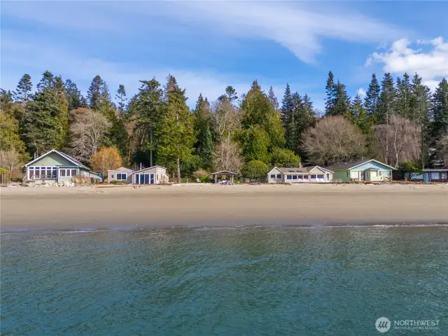 156 feet of waterfront and that sugar sand beach.  Three buildings in the middle are the waterfront part of the compound.