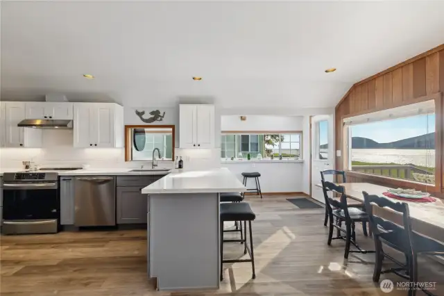 Kitchen has sit-down bar and separate dining area.
