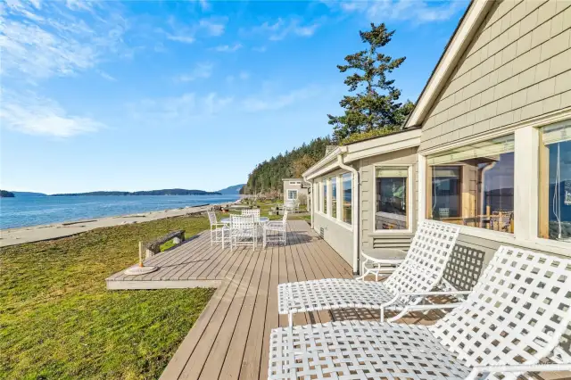 Expansive deck overlooking the sandy beach and islands.