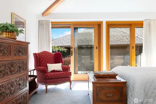 Primary Suite Sitting Area with View of Private Patio and Garden