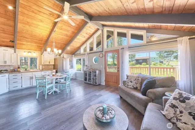 Great room features beautiful beams and expansive windows