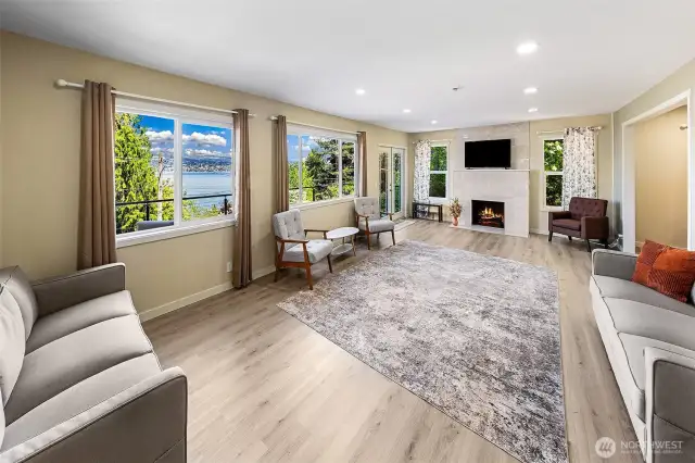 An expansive open living room & lake views upon entry.