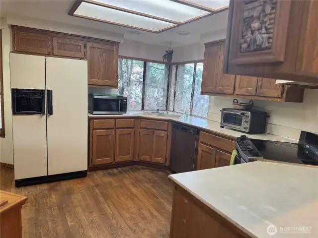 Photo taken from separate dining room looking back at the spacious kitchen!