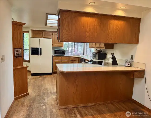 Bar at end of kitchen that connects to the dining room!