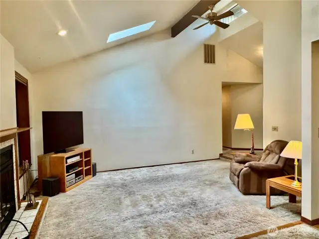 Living room with skylights and vaulted ceiling!