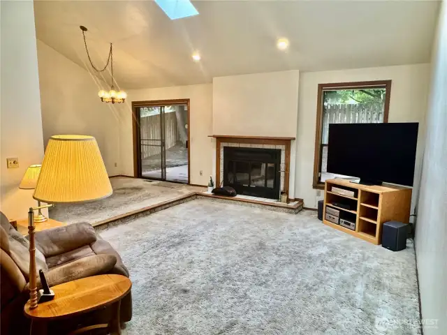 Heat vent in dining room is the easiest place to see the hardwoods under carpet.  JUST REMOVE THE HEAT VENT COVER & TAKE A PEEK!