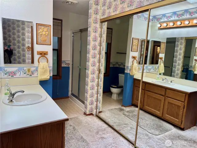3/4 bath off primary bedroom is LARGE with closet with mirrored doors!