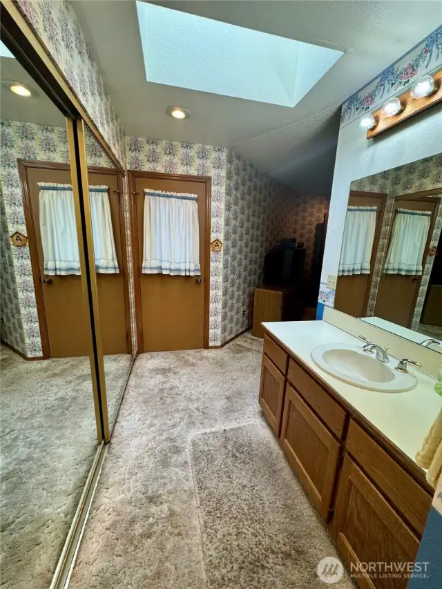 3/4 bath off primary bedroom has enclosed hot tub room just through the man door!