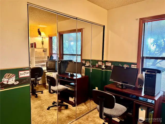 Bedroom #3.  Note the mirrored closet doors!  Seller is currently using this room as an office.