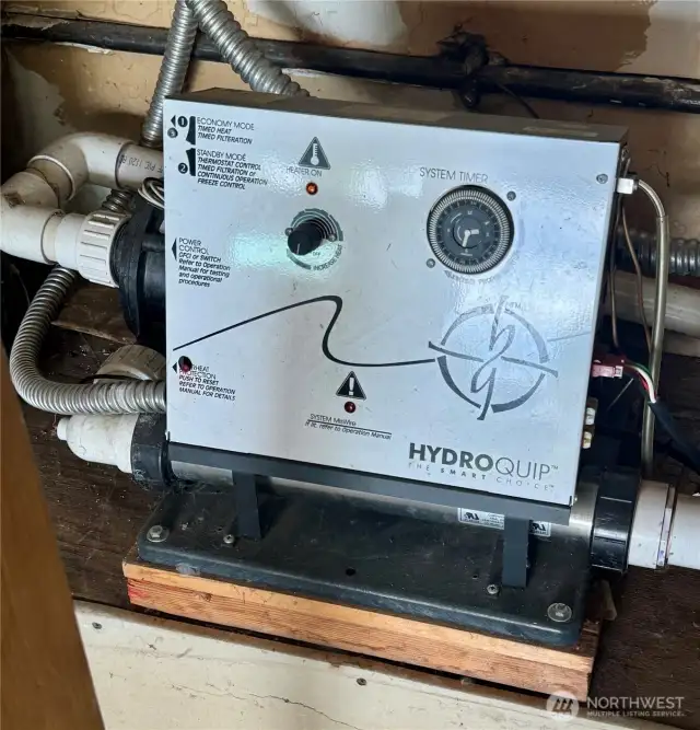 Hot tub heater located in the garage.