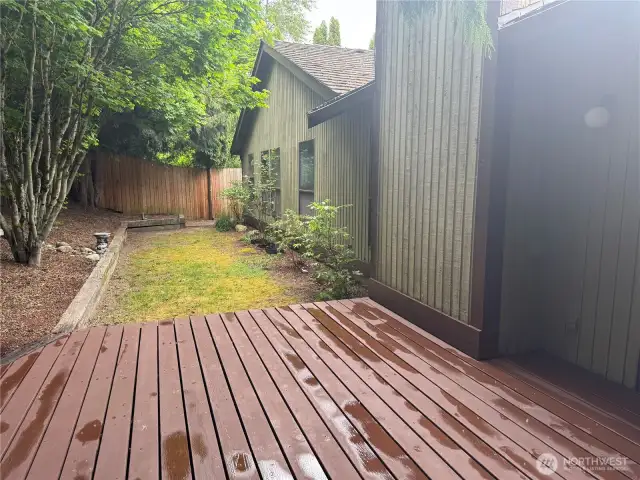 Deck off of dining room leds to a private backyard with a 7' fence! Side yard has storage shed!
