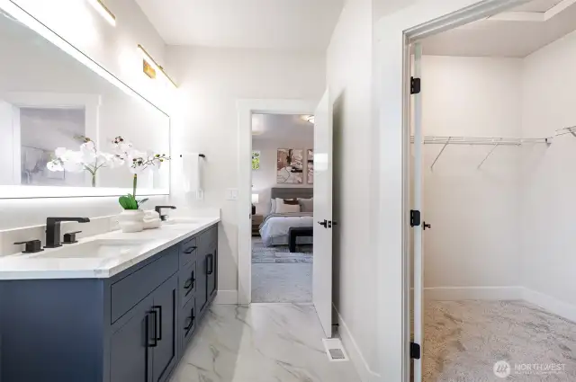Primary bath with view into Walk-in closet