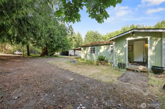 Driveway comes in off 41st to the left of the photo, along the west side of the property, for easy access to both homes, carport, and shed/barn.