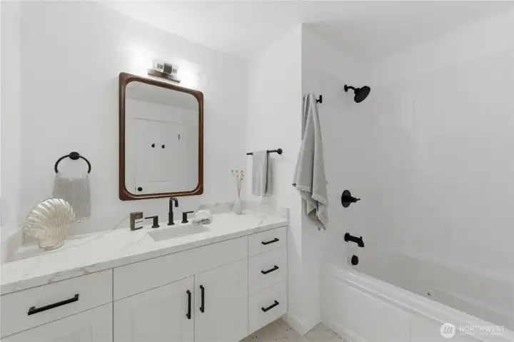 Main full bath with tub jets. Main full bath with tub jets.