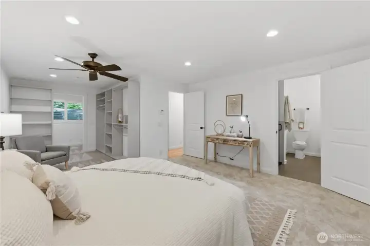 Primary bedroom with ensuite and a slider out to the hot tub.