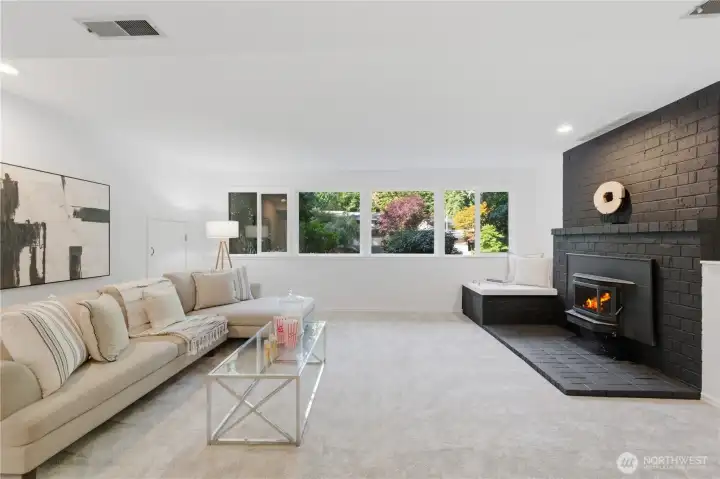 Family room with fireplace in the lower level.