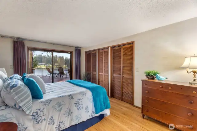 The spacious primary with slider to the large rear deck and views to the lake. What a great place to wake up!
