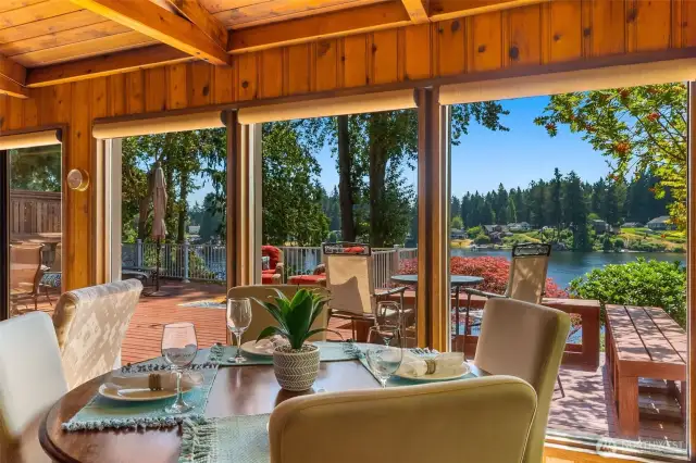 What a view from the dining table! All of these beautiful floor to ceiling windows to bring in the light and nature.
