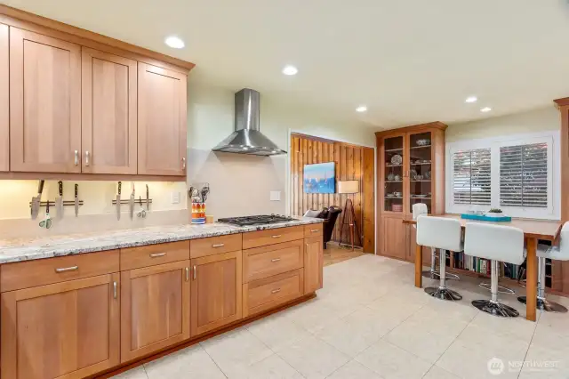 Designed by Cabinets by Trivana, and she thought of everything! Bleached cherry cabinetry with roll outs and carousels. Alaska White granite counters and large undermount sink. Stainless appliances, oven plus warming drawer.