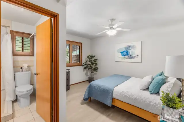 The third bedroom has an ensuite bath and is on the kitchen side of the home. This makes a terrific guest suite, since it is on the other side of the home from the other bedrooms. A guest could use the laundry/mud room entrance if you had someone longer term or a family member.