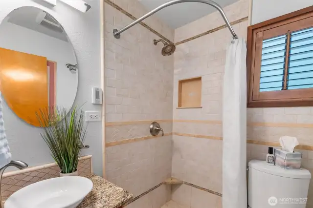 Ensuite bath with full tile shower, vessel sink with granite counter