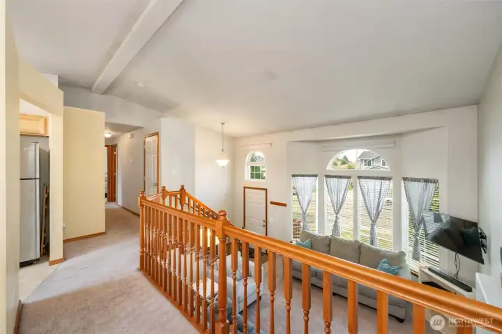 Hallway to guest bath, primary with ensuite and two additional bedrooms