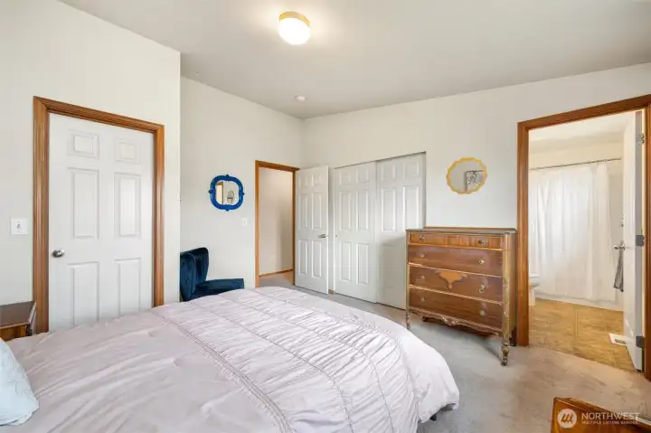 Walk-in closet door on the left, ensuite on the right
