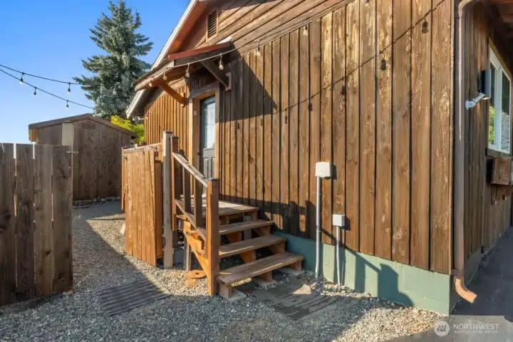 outside entrance for apartment with private fenced courtyard