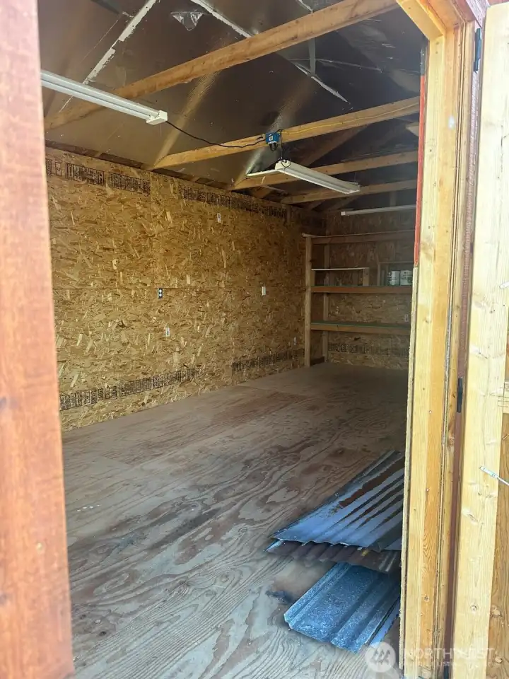Inside the wood shed next to the apartment entrance