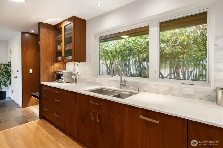 Amazing counter space, tons of storage and built in dishwasher all add to the modern touches.